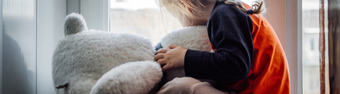 A child holding a toy