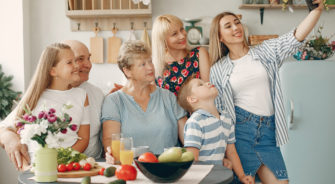 Beautiful big family prepare food in a kitchen