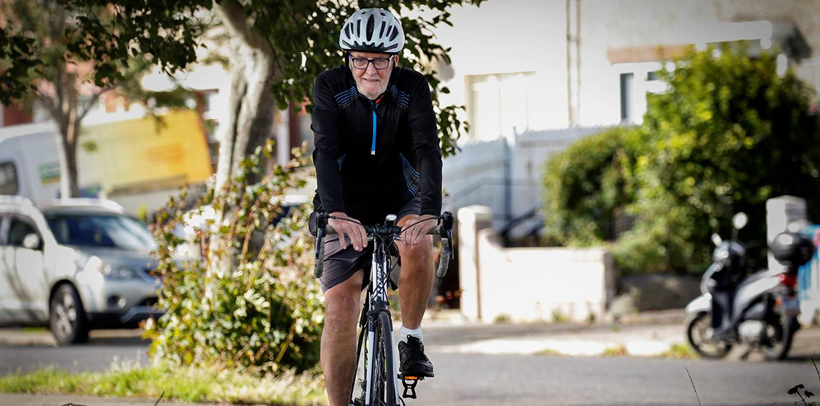 A man cycling on his bike