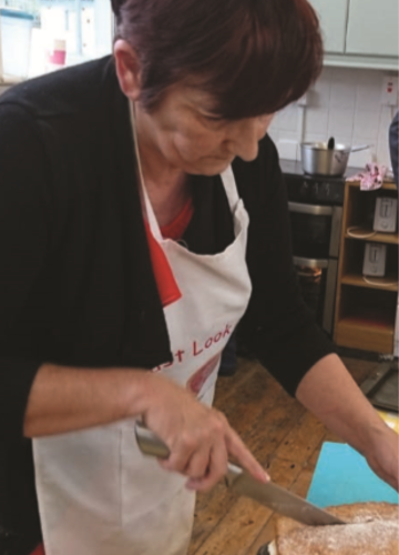 Woman cutting a cake