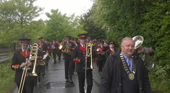 Mayor walking ahead of band