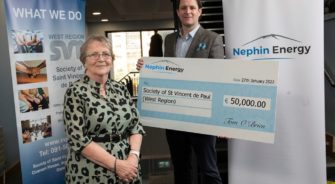 A lady receiving a big cheque