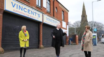 Members of SVP around a Vincent's shop