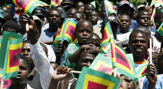 Zimbabwe people holding the flags