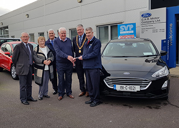 People accepting car from Cork Lord Mayor and SVP