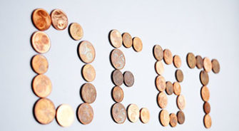 Coins arranged spelling Debt