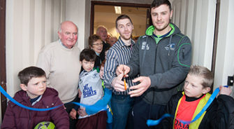 SVP members cutting a ribbon for the SVP shop in Oranmore