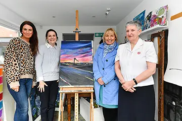 Artist Aly Harte presents Laura Jackson with "Belfast Beauty" following her donation to an appeal which raised more than £2,100 for SVP and The Salvation Army. Joining Aly as she hands over the original are Pauline Brown of SVP and Jacqueline Wright of The Salvation Army.