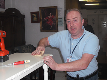 John Reilly of Navan SVP’s St. Francis Special Works Conference prepares a table for the coming chalk painting demonstration.