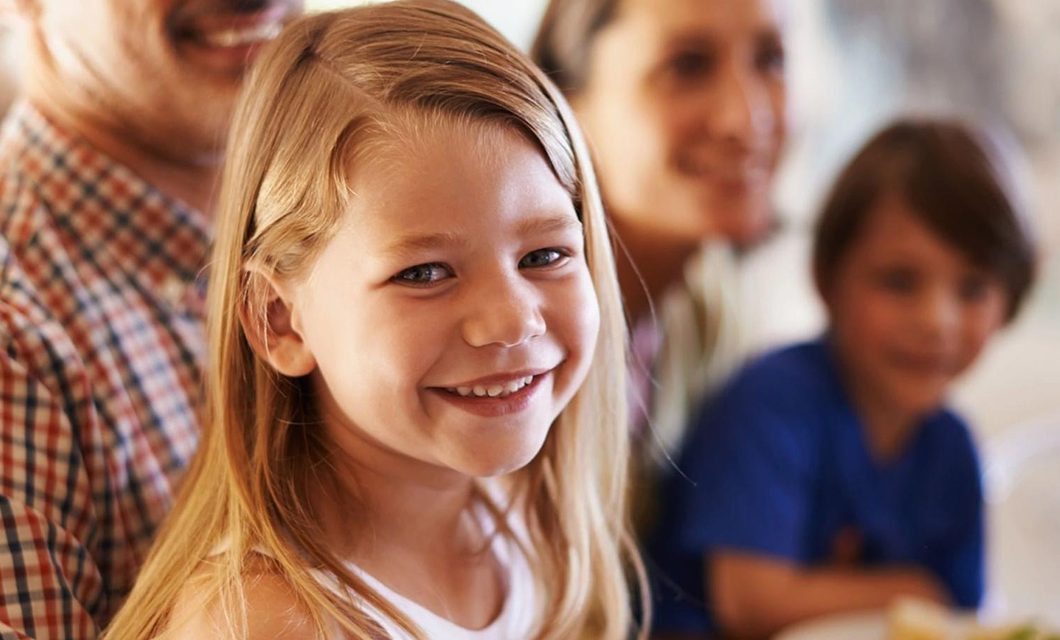 A girl smiling while looking at the camera