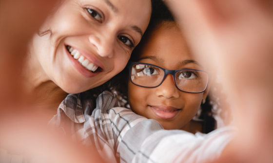 Help us end poverty. A mother and daughter