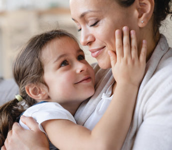 A daughter touching her mother's face