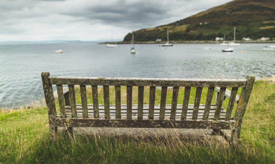 An empty bench facing the sea