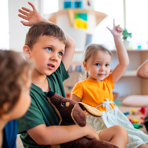 Kids raising their hands