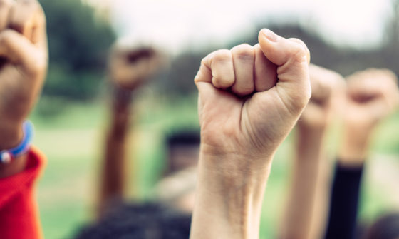 People raising their fists in the air