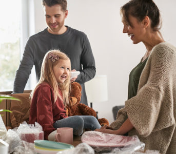 A family packing their belongings