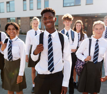 Students standing outside a school