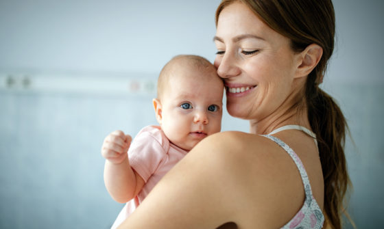 A happy mother holding her child