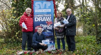 SVP members presenting the christmas car draw