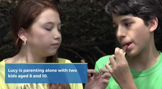 Two kids eating Twix