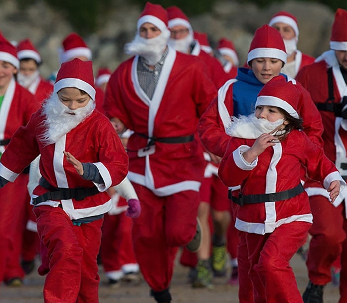 A group of santas running
