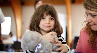 A girl holding her toy