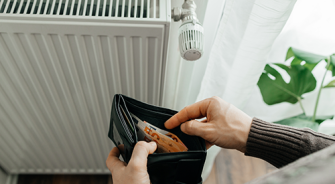 A man looking into his wallet