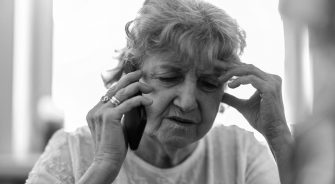 Shot of a tired senior woman using a mobile phone
