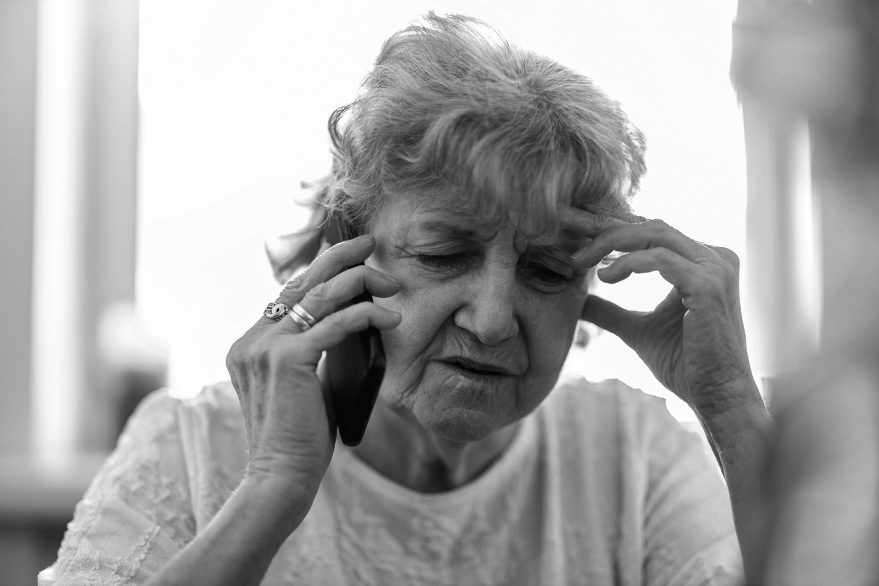 Shot of a tired senior woman using a mobile phone