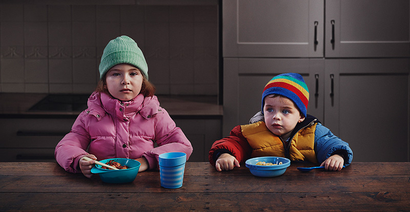 Two kids eating dinner