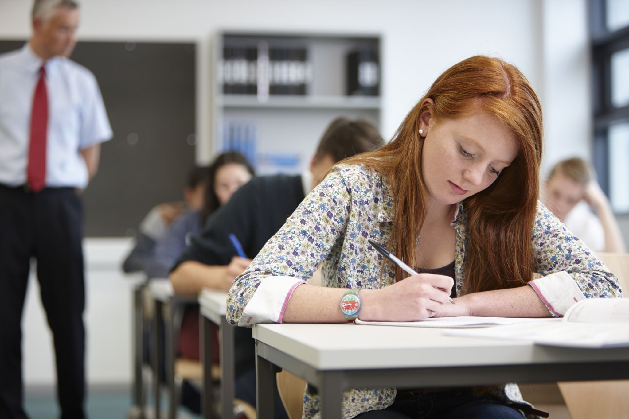 A girl attending her examination in the college