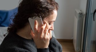 sadness woman talking by smartphone