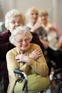 Elderly people participate in chair exercises during a health promotion day run by the Bradford Council.