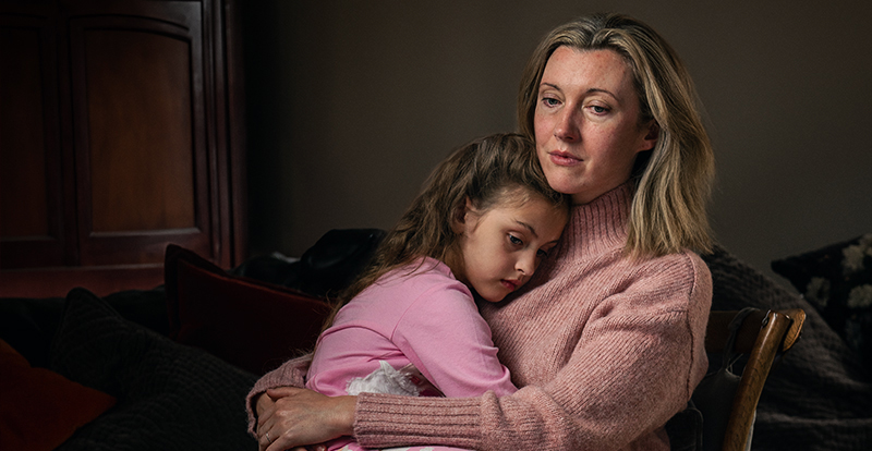 Lady hugging daughter