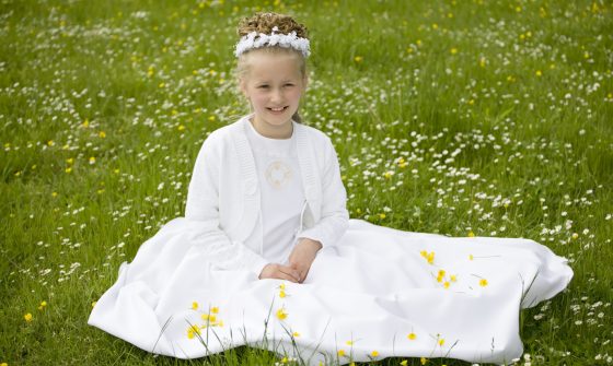 girl wearing first communion dress