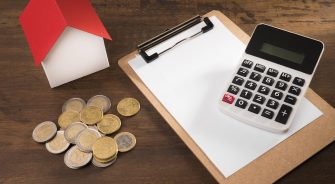 calculator, house and coins